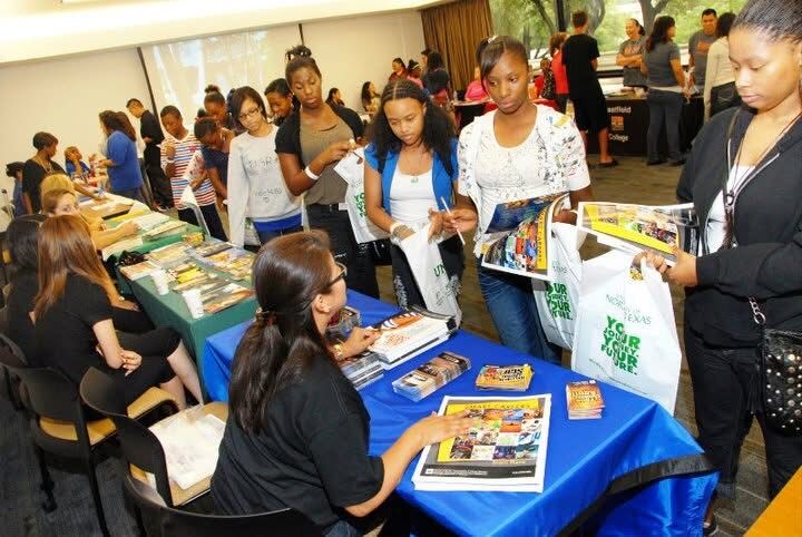 Teens visiting resource tables at a Keepin’ It Real! Youth Empowerment Summit