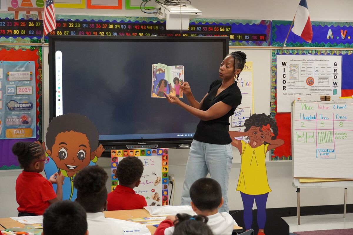 Reading to students at Frank Guzick Elementary during the SMU book day